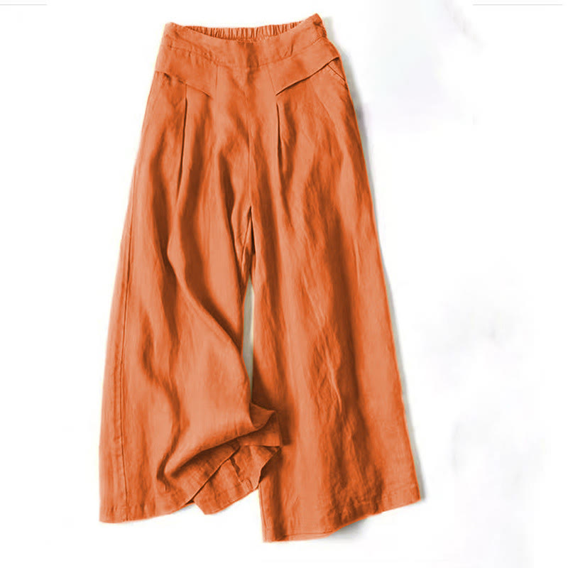 Weite orange Damenhose aus Leinen, modisch und bequem, ideal für Sommeroutfits. Perfekt für lässige und elegante Anlässe.